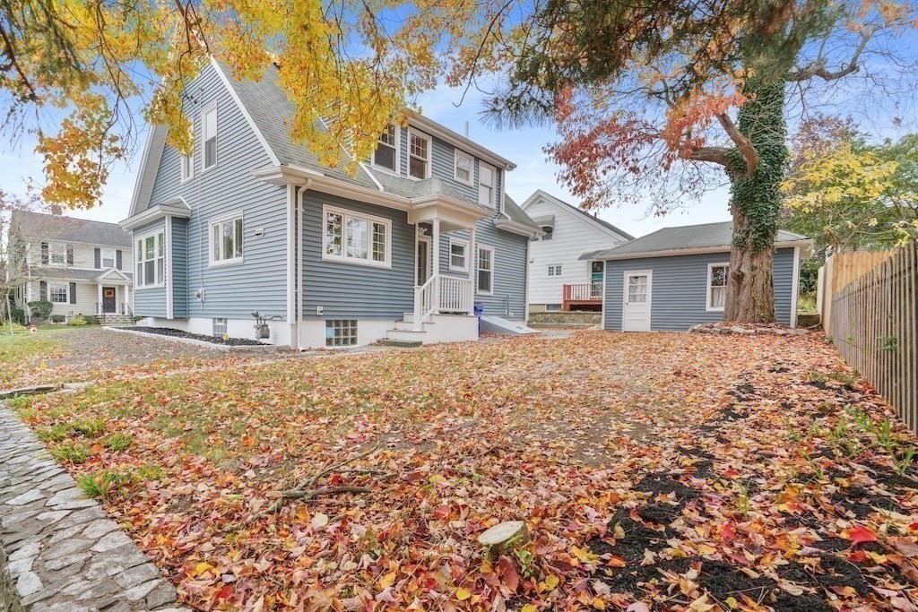 274 Archer Street Fall River, MA 02720 - Photo 3 of 29 a front view of a house with a yard covered with snow