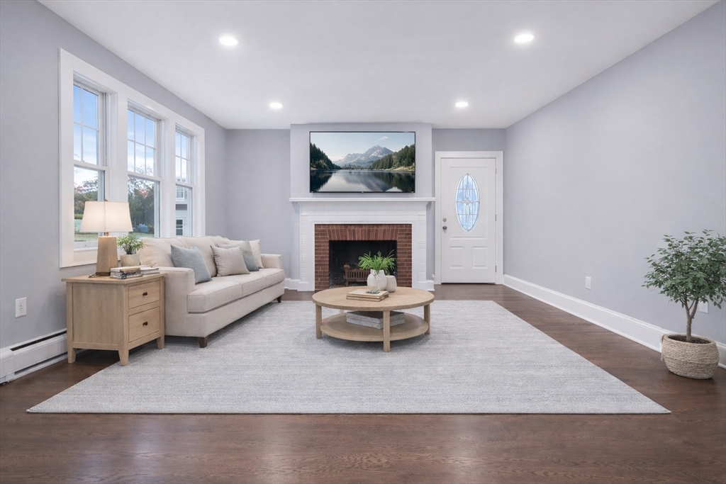 274 Archer Street Fall River, MA 02720 - Photo 9 of 29 a living room with furniture and a fireplace