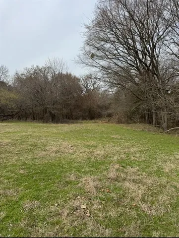 a view of a pool with a yard