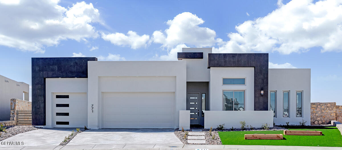 7320 Enchanted Pt Drive El Paso, TX 79911 - Photo 1 of 1 a front view of a house with garden