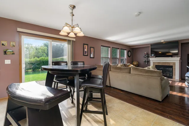 a living room with furniture a window and a fireplace