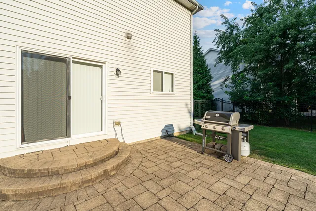 a backyard of a house with outdoor seating