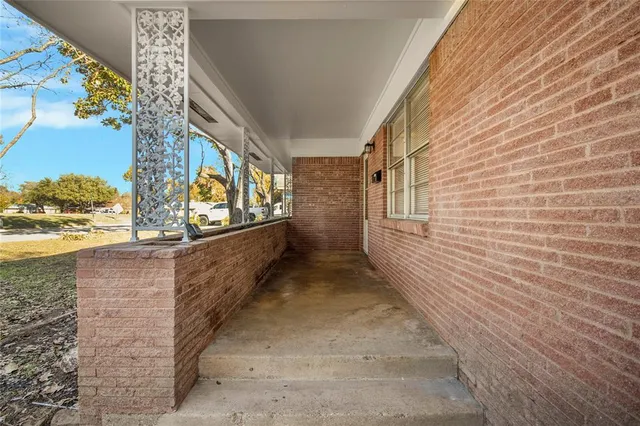 a view of entryway with a wooden door