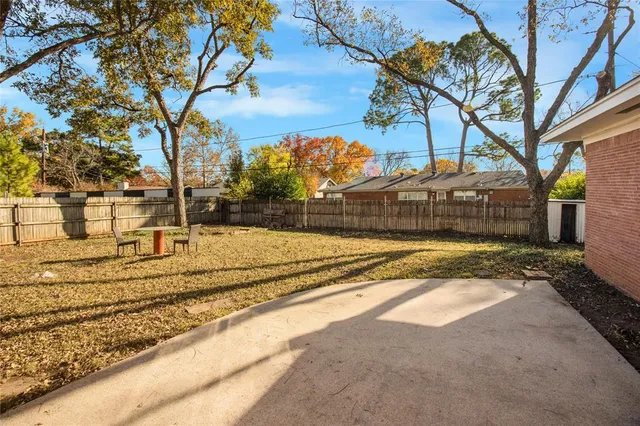 a view of yard along with trees