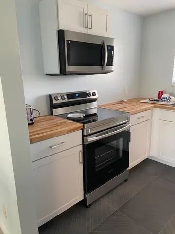a kitchen with a stove and a microwave