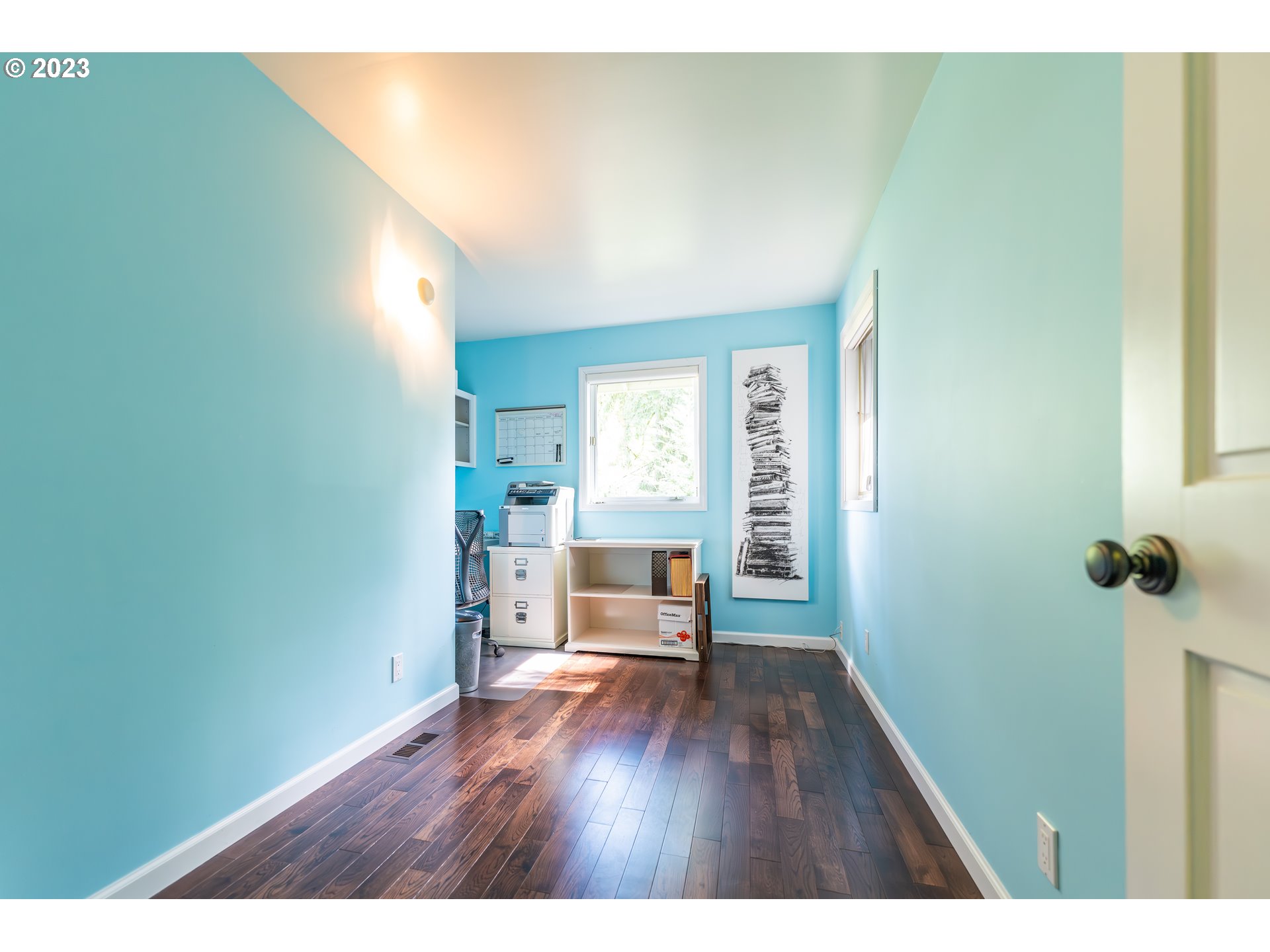 3955 Spring Boulevard Eugene, OR 97405 - Photo 33 of 48 a hallway with wooden floor and furniture