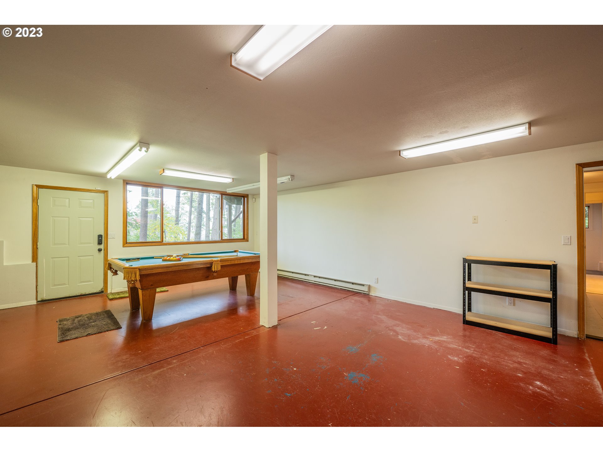 3955 Spring Boulevard Eugene, OR 97405 - Photo 41 of 48 a room with lots of wooden furniture and a window