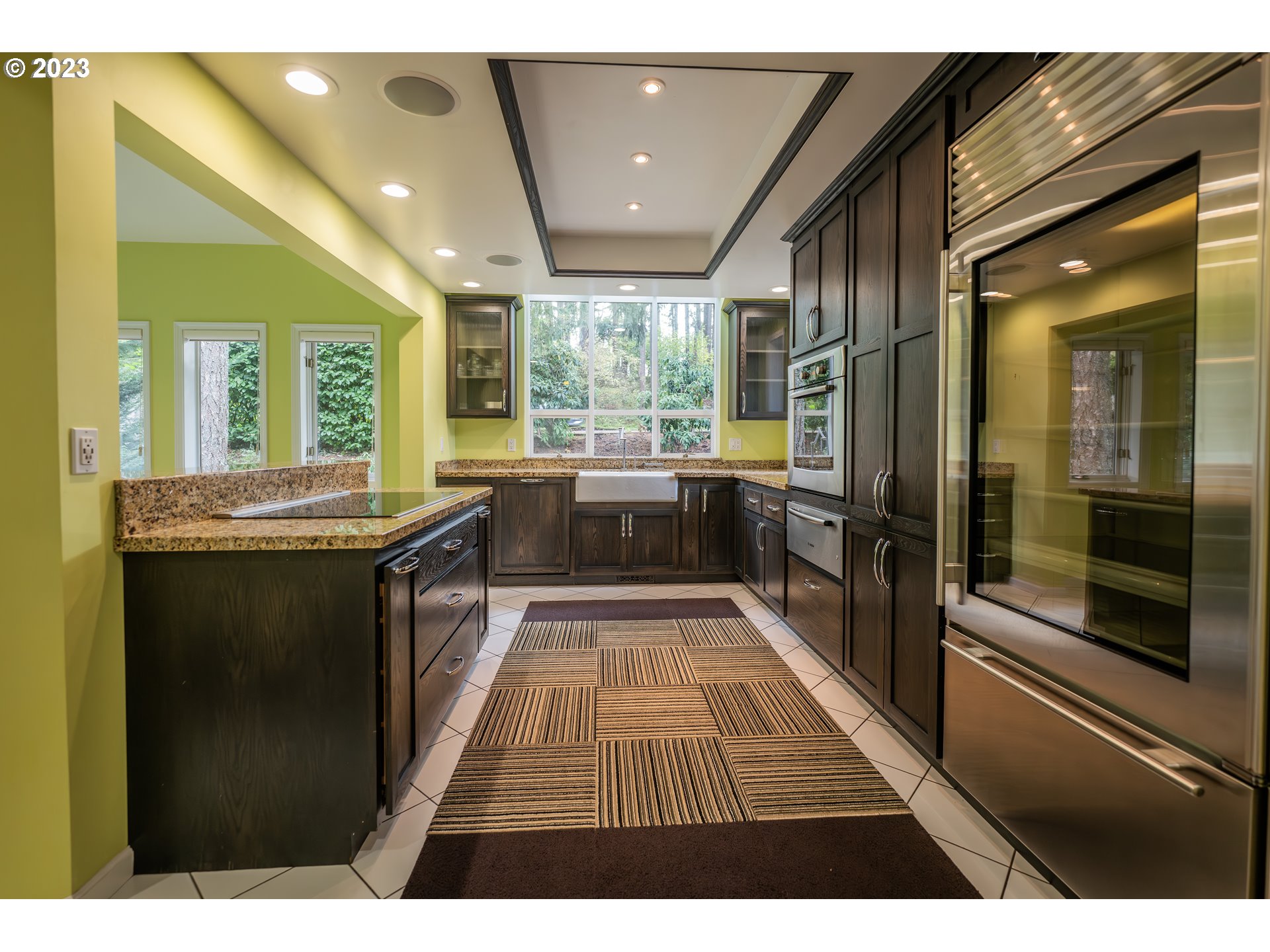 3955 Spring Boulevard Eugene, OR 97405 - Photo 8 of 48 a large kitchen with kitchen island a large window