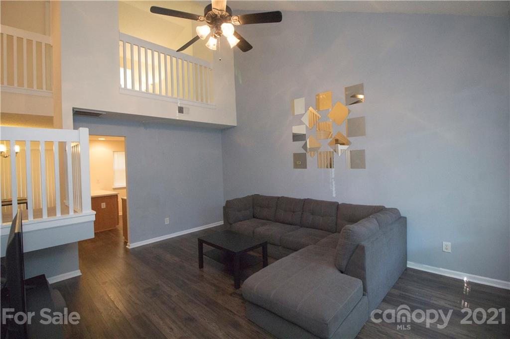 8360 Rudolph Road Charlotte, NC 28216 - Photo 4 of 20 a living room with furniture and a window