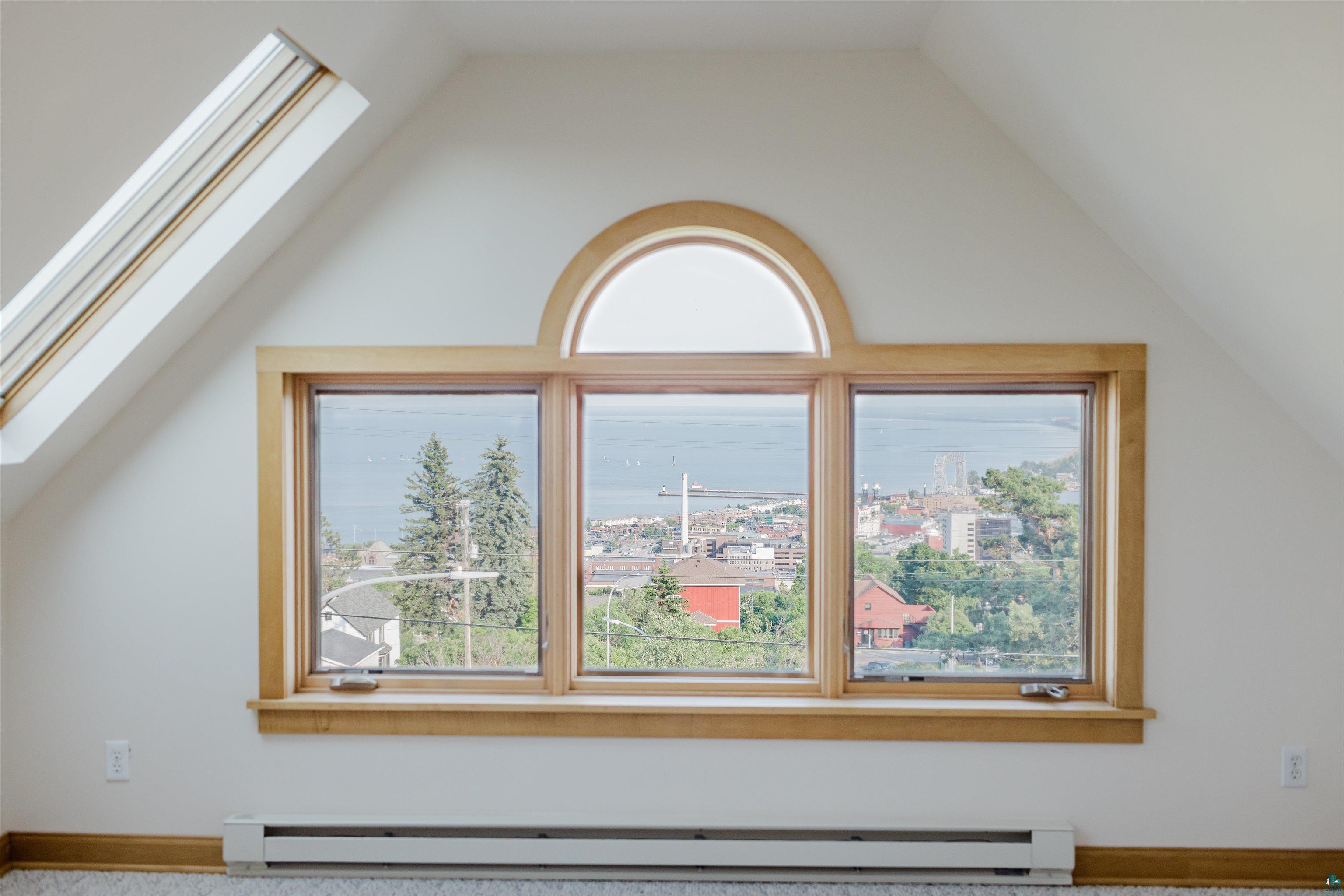 13 West 8th Street Duluth, MN 55806 - Photo 34 of 57 Triple-pane picture window with an arched transom, wood-finish trim, and a window sill