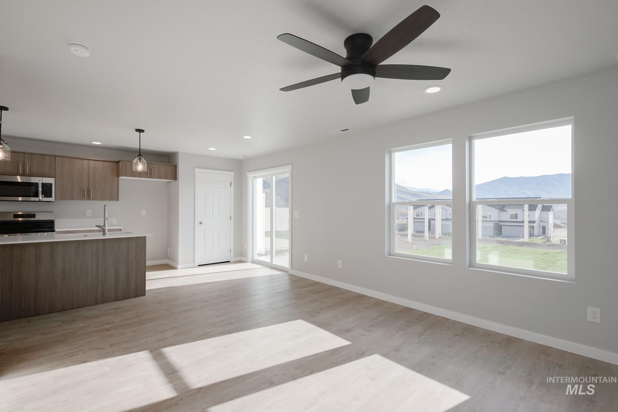 229 Moose Street Horseshoe Bend, ID 83629 - Photo 24 of 26 Kitchen with pendant lighting, modern cabinets, stainless steel appliances, open floor plan, and recessed lighting