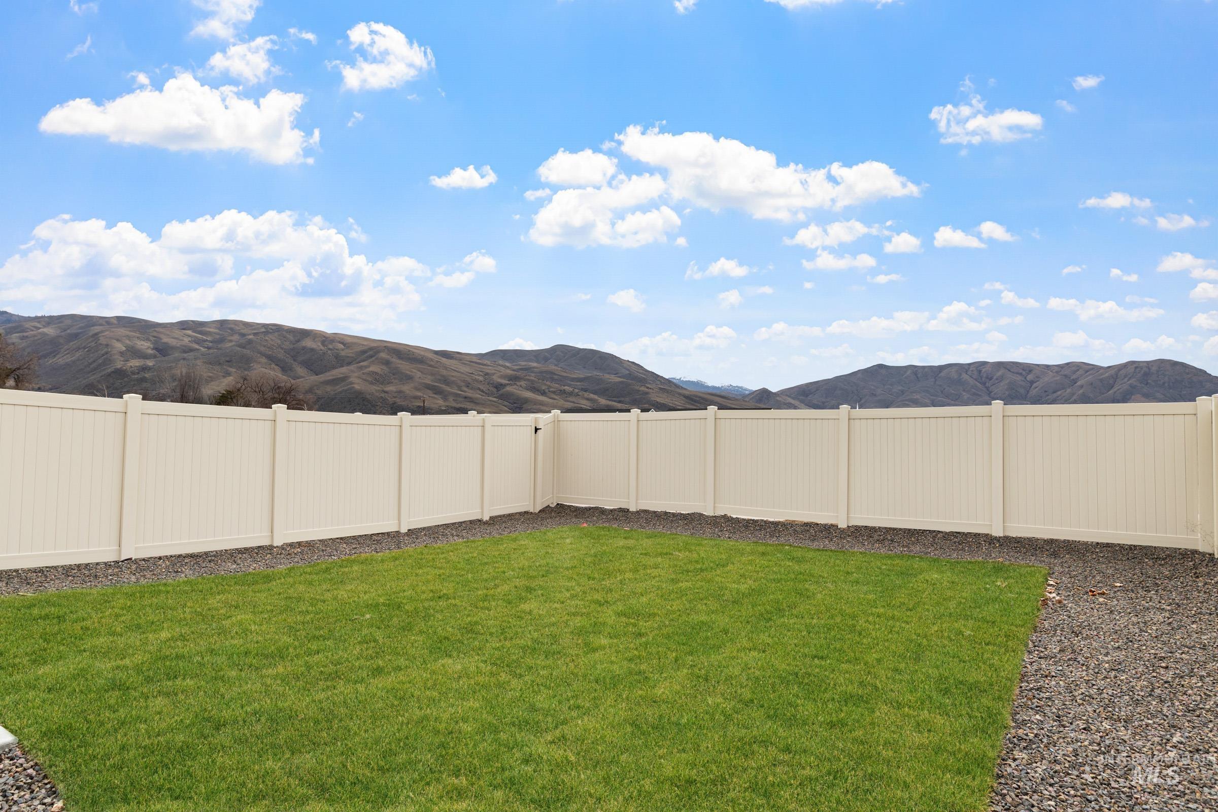 229 Moose Street Horseshoe Bend, ID 83629 - Photo 24 of 27 Fenced backyard with a mountain view