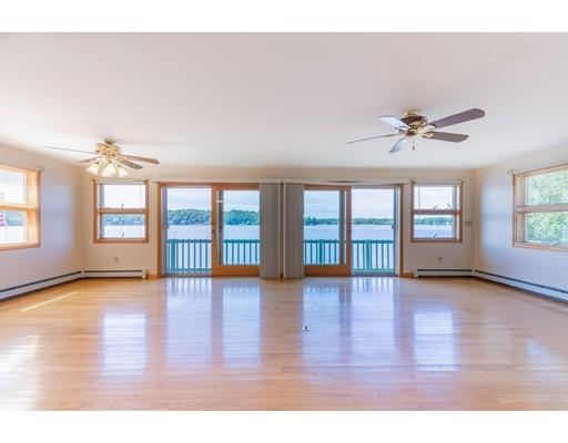 82 Lake Attitash Road Amesbury, MA 01913 - Photo 12 of 42 a view of an empty room with wooden floor and a window
