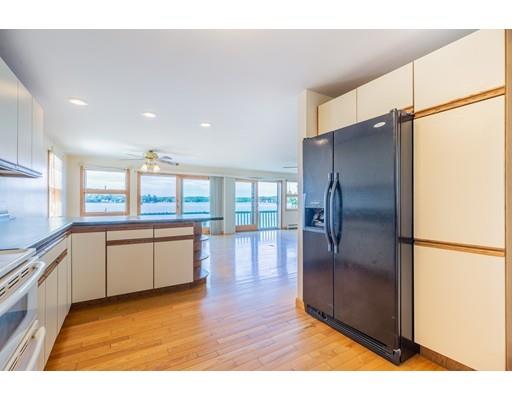82 Lake Attitash Road Amesbury, MA 01913 - Photo 18 of 42 a kitchen with stainless steel appliances granite countertop a refrigerator and a sink