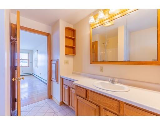 82 Lake Attitash Road Amesbury, MA 01913 - Photo 23 of 42 a bathroom with a sink and a mirror