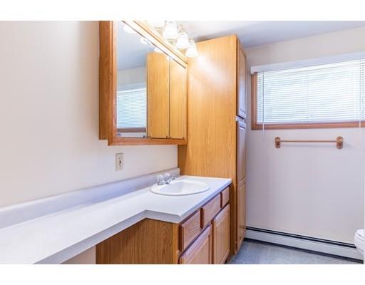82 Lake Attitash Road Amesbury, MA 01913 - Photo 28 of 42 a bathroom with a sink and a mirror