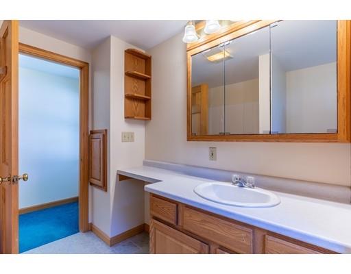 82 Lake Attitash Road Amesbury, MA 01913 - Photo 29 of 42 a bathroom with a sink and a mirror