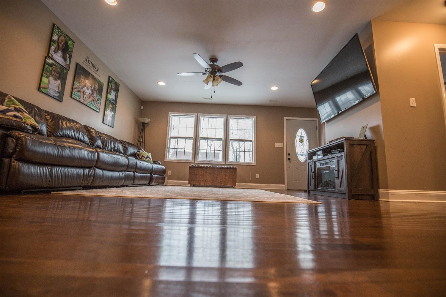 712 Fremont Road Valparaiso, IN 46385 - Photo 3 of 11 a view of a livingroom with furniture staircase and a kitchen