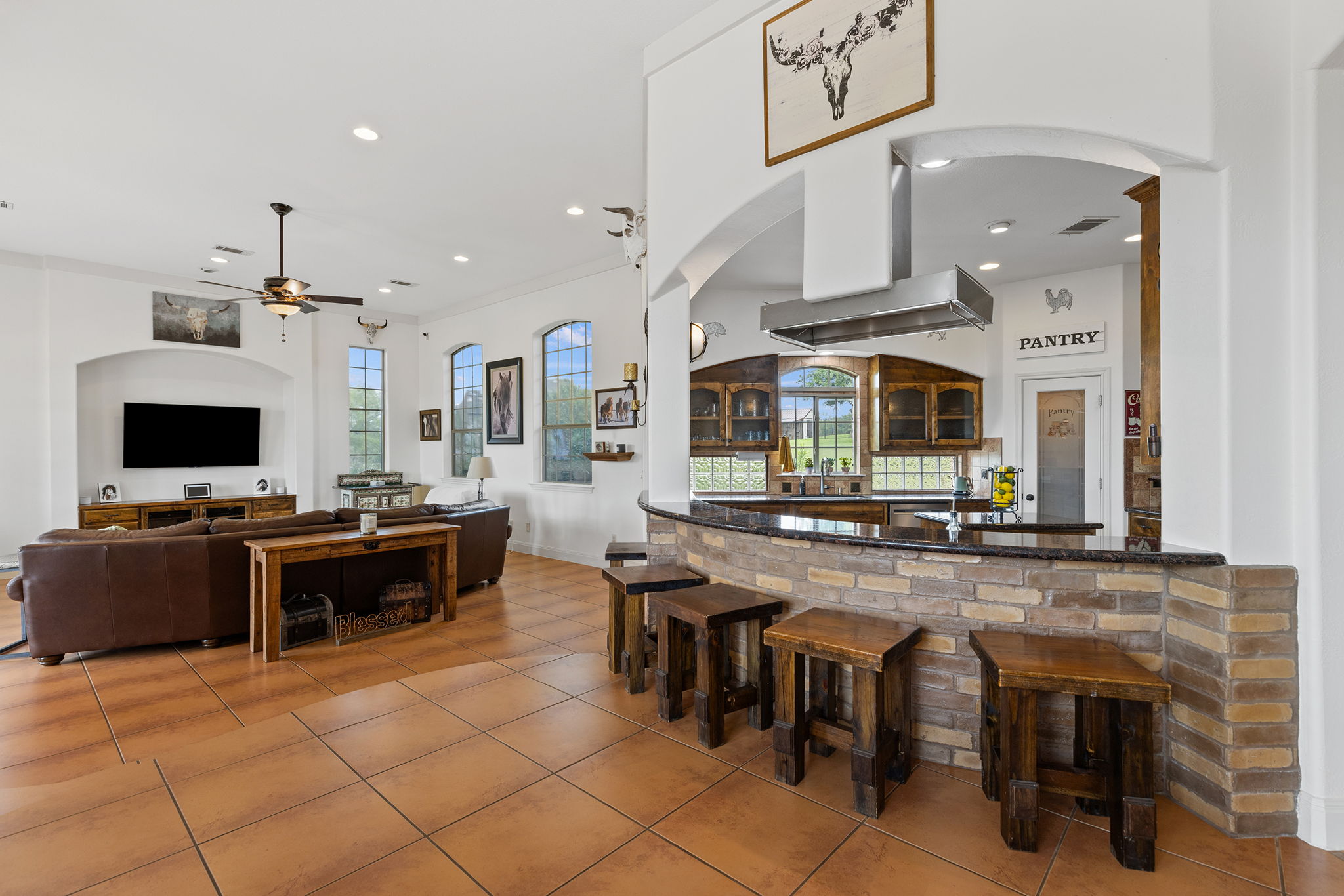 17308 St Therese Road Manor, TX 78653 - Photo 11 of 40 a large kitchen with a table and chairs in it