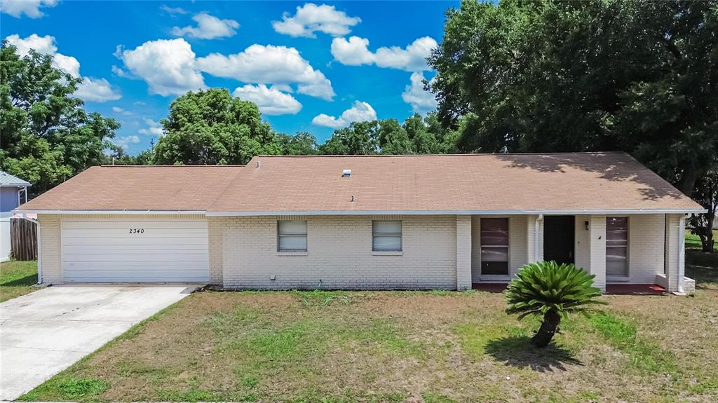 2340 Merrily Circle South Seffner, FL 33584 - Photo 2 of 52 a house that has a tree in front of it