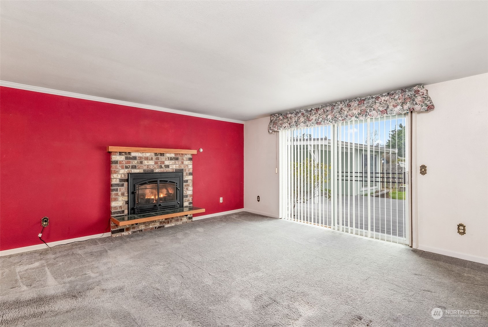 720 Memory Lane Port Townsend, WA 98368 - Photo 13 of 33 a view of an empty room with a fireplace and a window