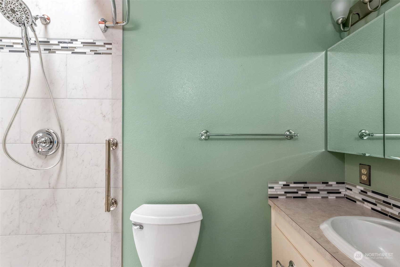 720 Memory Lane Port Townsend, WA 98368 - Photo 19 of 33 a bathroom with a granite countertop toilet sink and mirror