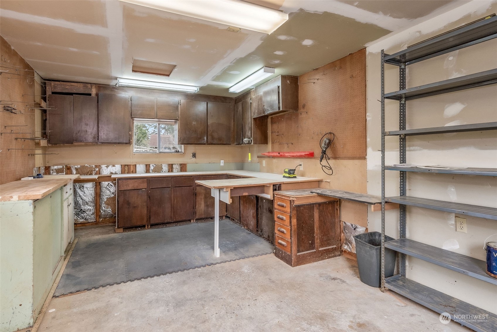 720 Memory Lane Port Townsend, WA 98368 - Photo 32 of 33 a kitchen with a sink stove and cabinets