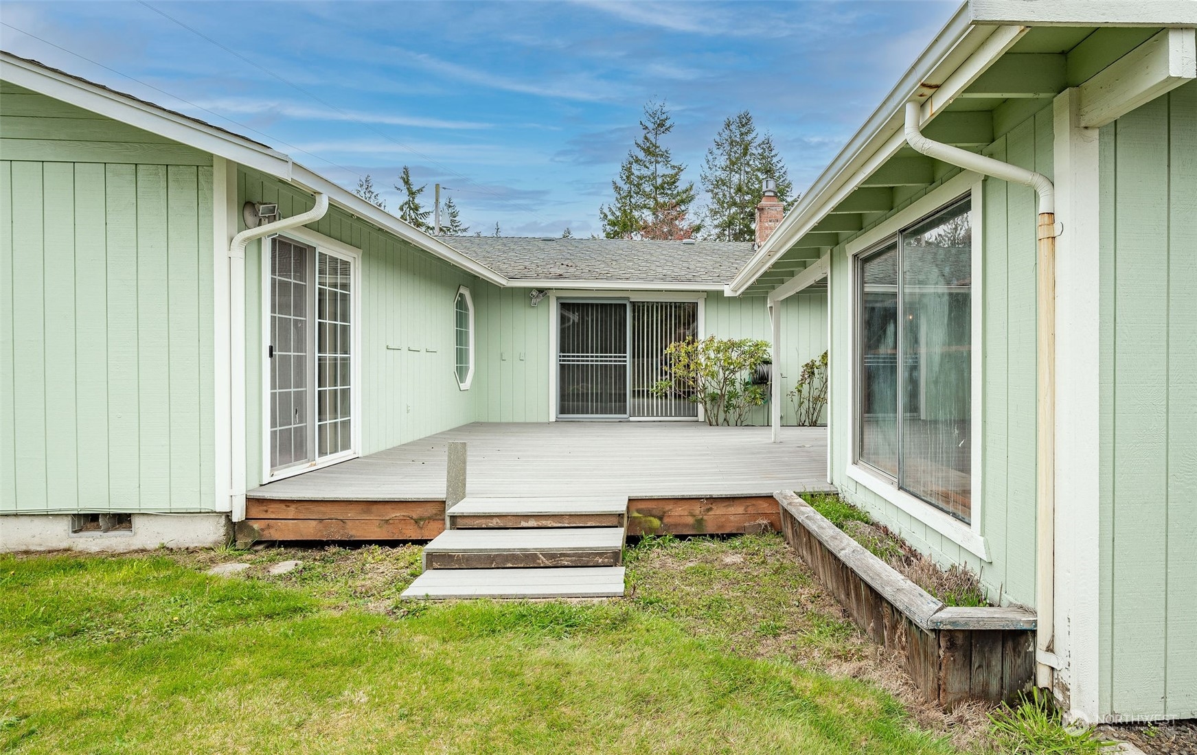 720 Memory Lane Port Townsend, WA 98368 - Photo 6 of 33 a view of a house with a porch and a bench