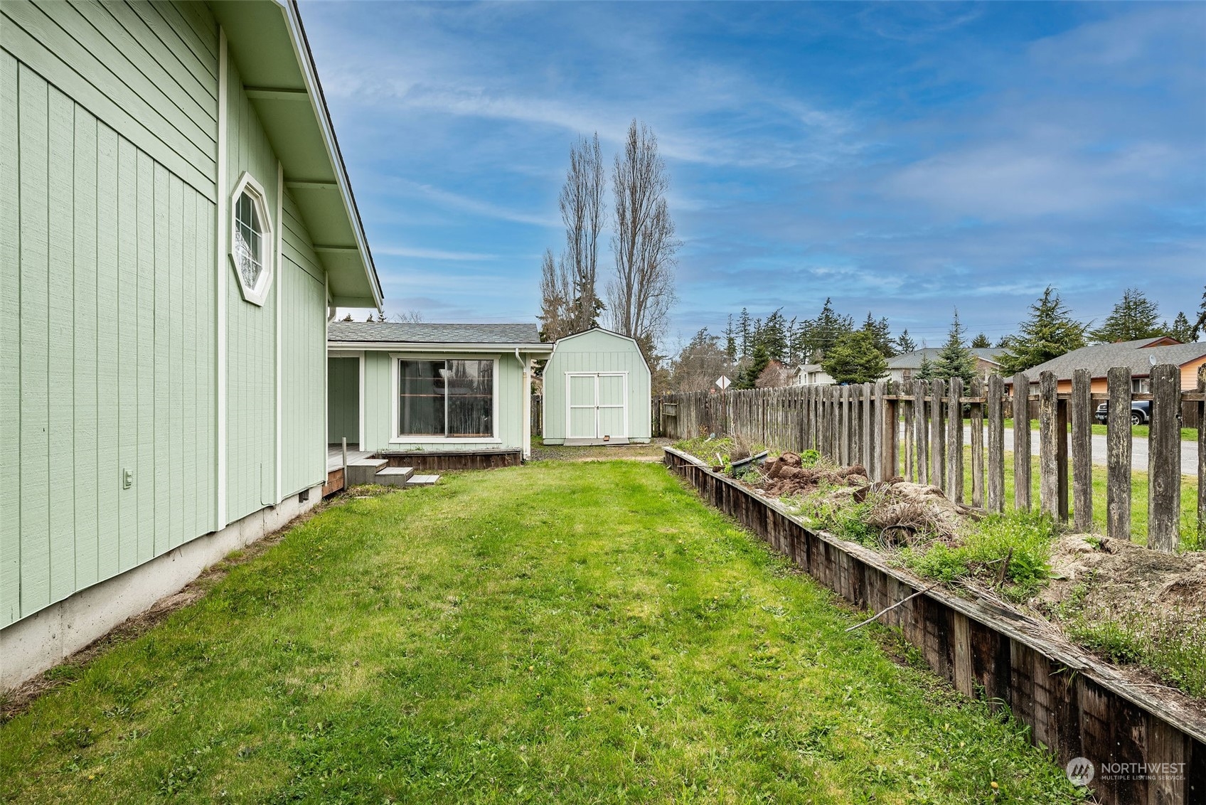720 Memory Lane Port Townsend, WA 98368 - Photo 9 of 33 a house view with a garden space