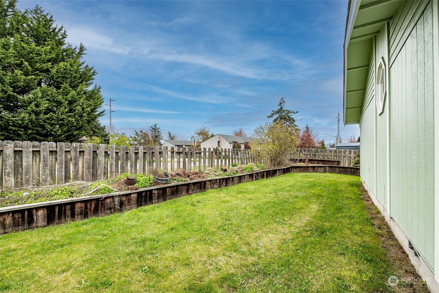 720 Memory Lane Port Townsend, WA 98368 - Photo 10 of 33 a view of a house with backyard and porch