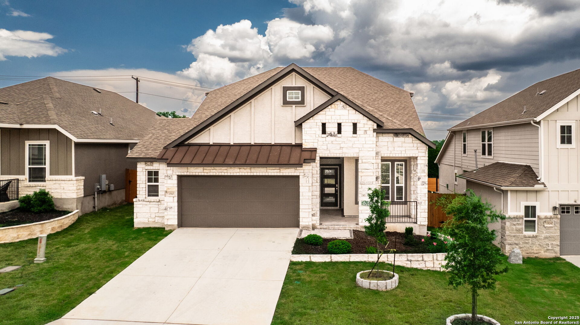 a front view of a house with garden