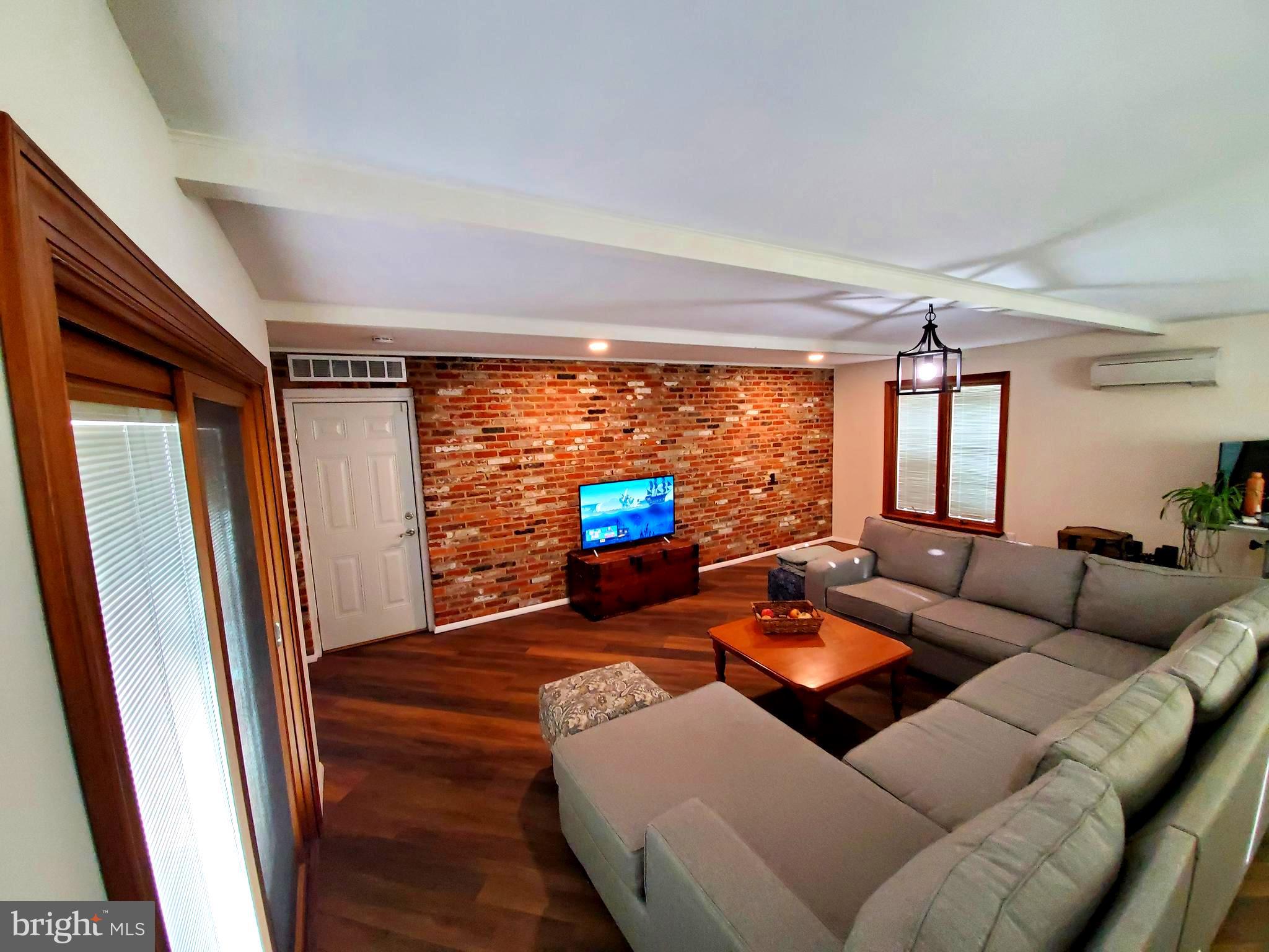 106 Cheltenham Road Newark, DE 19711 - Photo 16 of 23 Beautiful Expansive Brick Wall in Great Room