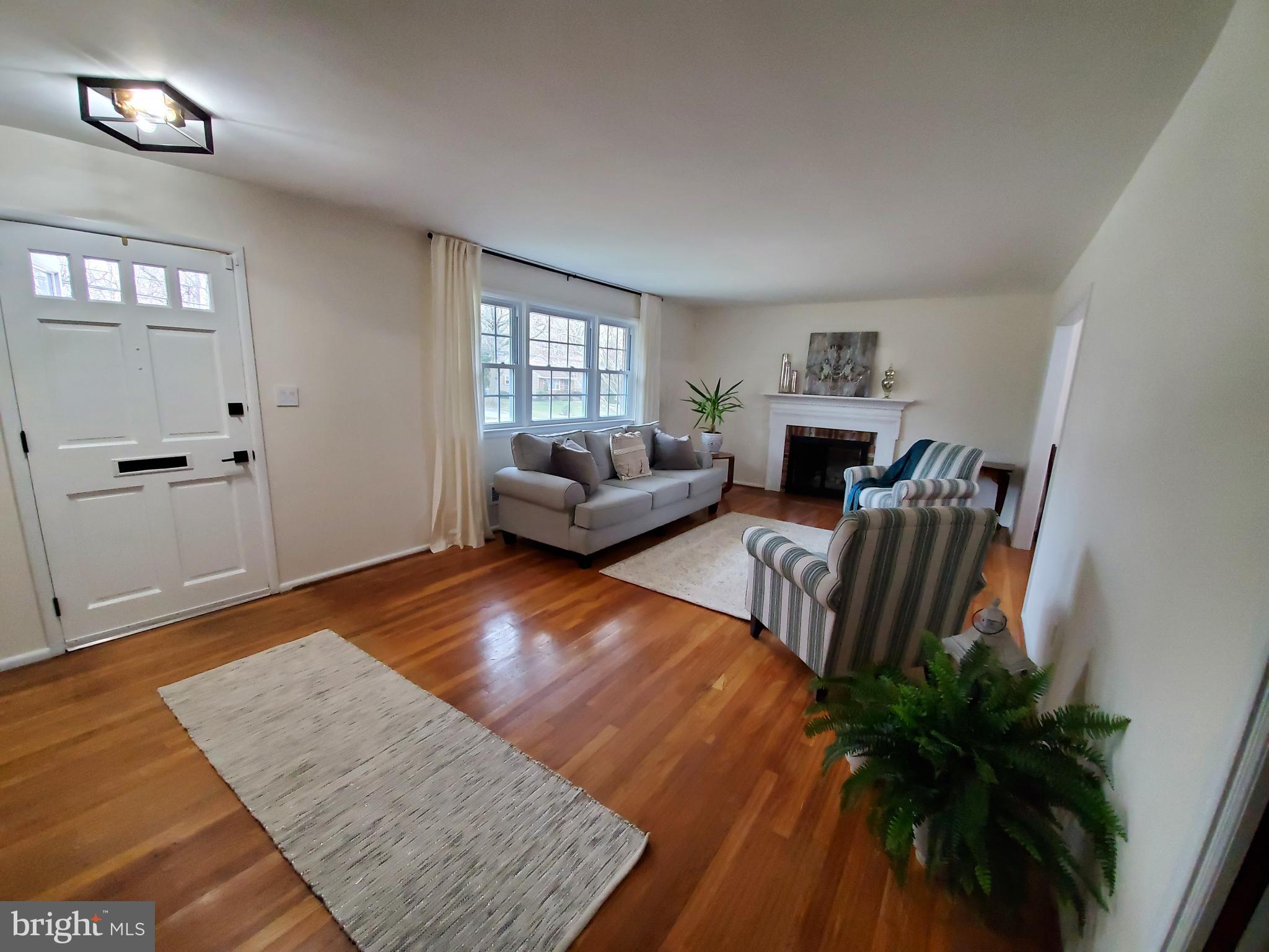 106 Cheltenham Road Newark, DE 19711 - Photo 6 of 23 A wall of windows lets natural light fill the LR