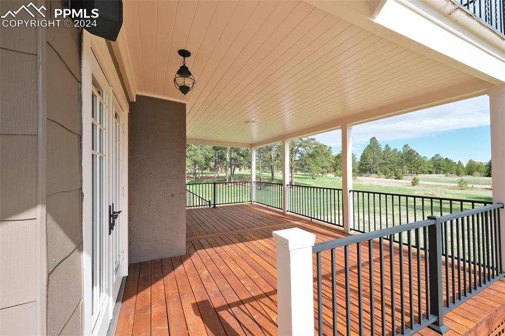 11508 Shaugnessy Road Colorado Springs, CO 80908 - Photo 11 of 49 a view of balcony with a floor to ceiling window and wooden floor