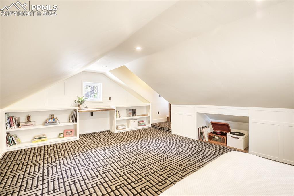 11508 Shaugnessy Road Colorado Springs, CO 80908 - Photo 25 of 49 a bedroom with a bed and a view of kitchen