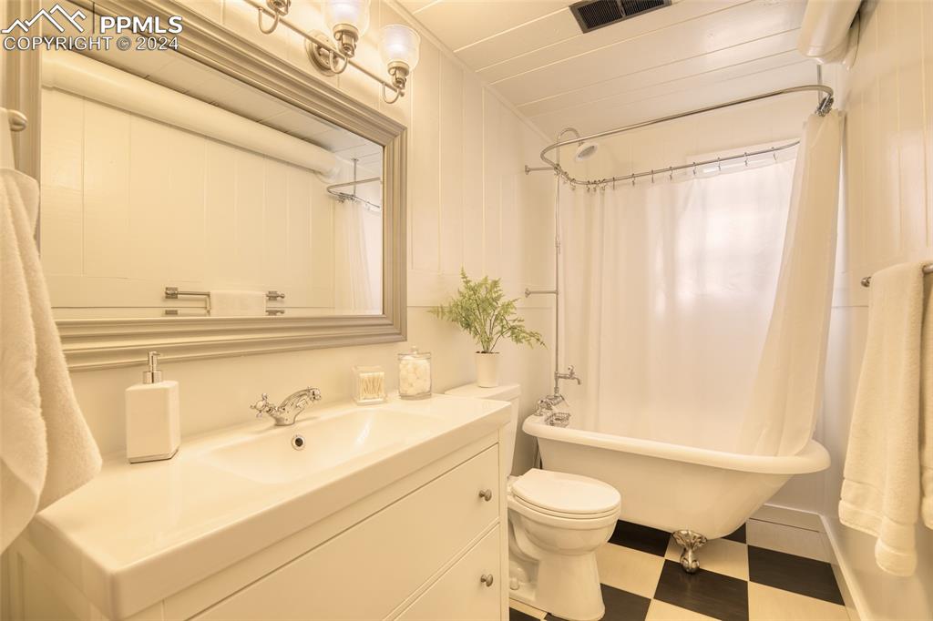 11508 Shaugnessy Road Colorado Springs, CO 80908 - Photo 29 of 49 a bathroom with a sink toilet and shower
