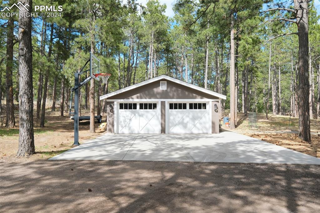 11508 Shaugnessy Road Colorado Springs, CO 80908 - Photo 32 of 49 a house with trees in the background