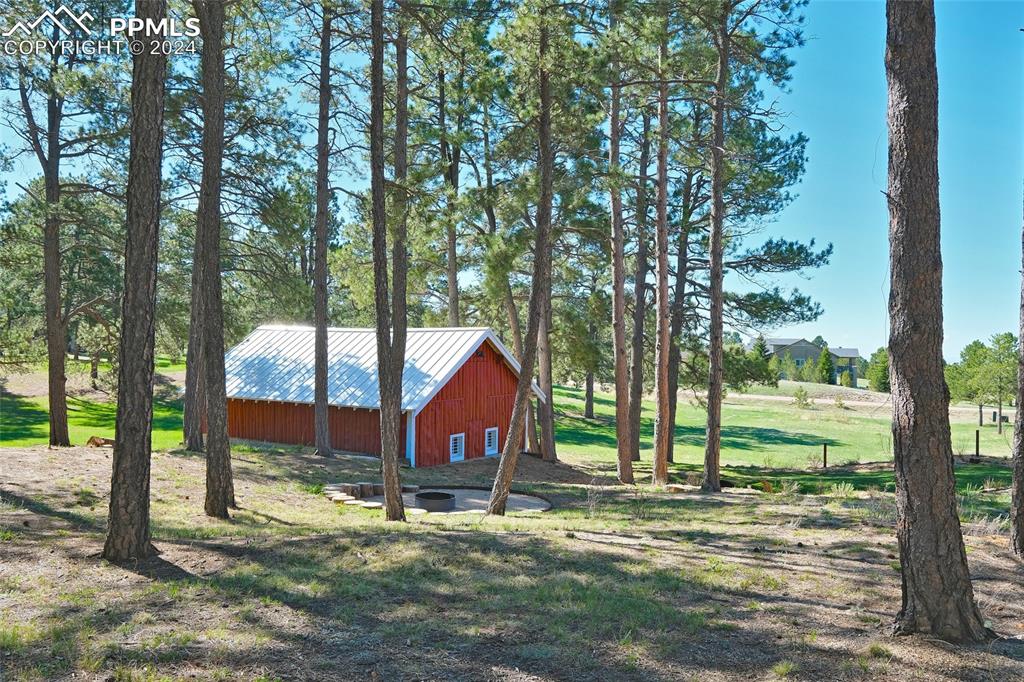 11508 Shaugnessy Road Colorado Springs, CO 80908 - Photo 40 of 49 a view of a house with a yard
