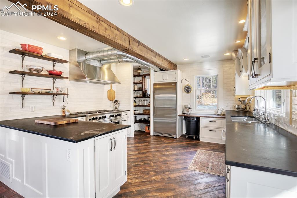 11508 Shaugnessy Road Colorado Springs, CO 80908 - Photo 4 of 49 a kitchen with stainless steel appliances granite countertop a stove and a sink