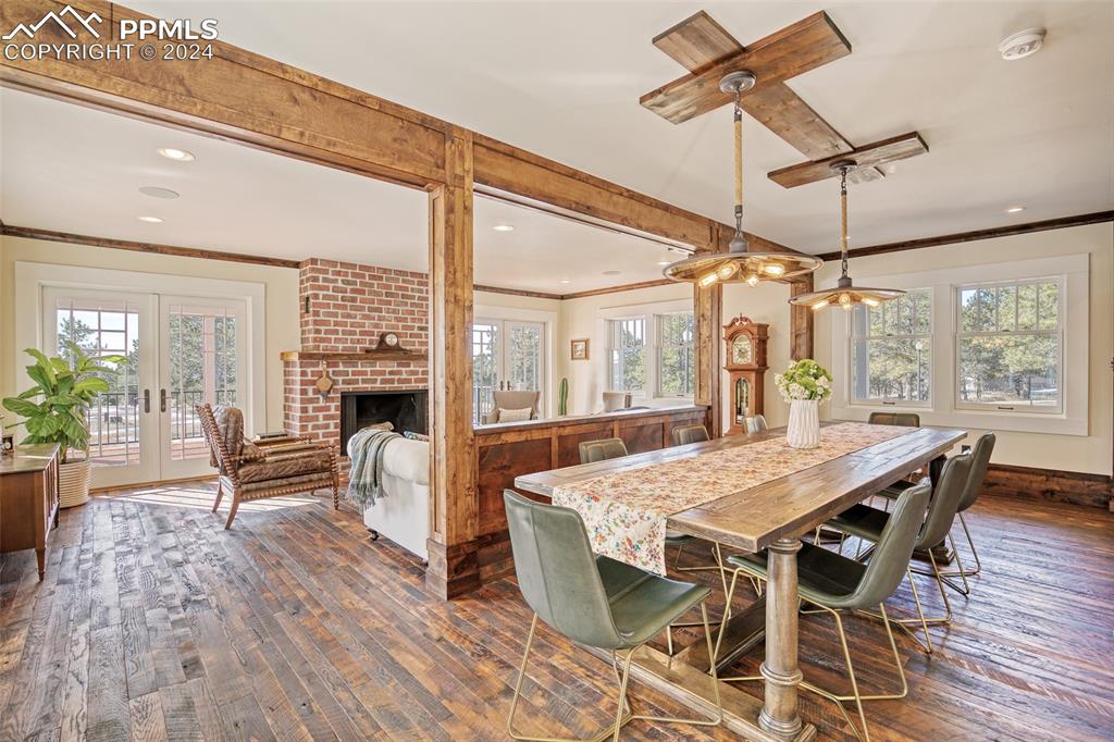 11508 Shaugnessy Road Colorado Springs, CO 80908 - Photo 45 of 49 a dining room with furniture window and wooden floor