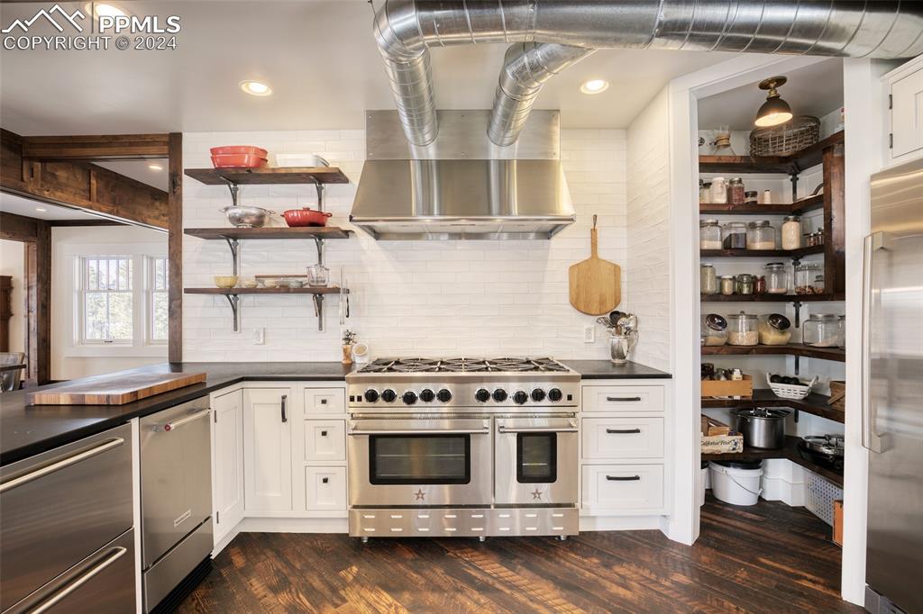 11508 Shaugnessy Road Colorado Springs, CO 80908 - Photo 5 of 49 a kitchen with stainless steel appliances granite countertop a stove and a sink