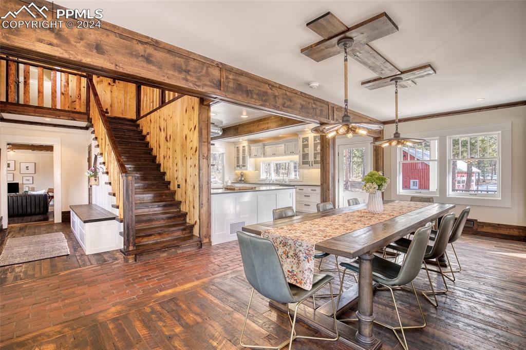 11508 Shaugnessy Road Colorado Springs, CO 80908 - Photo 8 of 49 a view of a dining room with furniture window and wooden floor