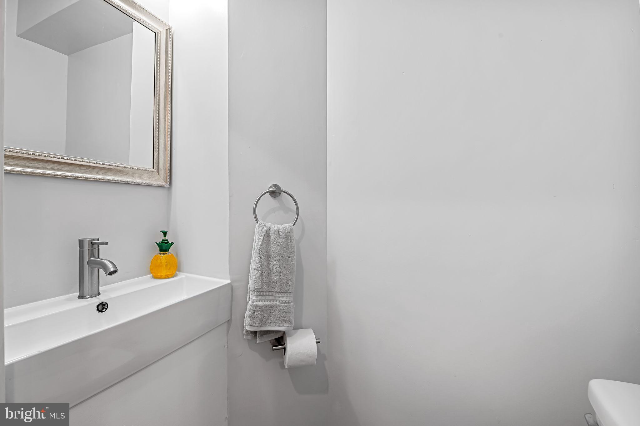 512 North Port Street Baltimore, MD 21205 - Photo 11 of 23 a bathroom with a sink and toilet