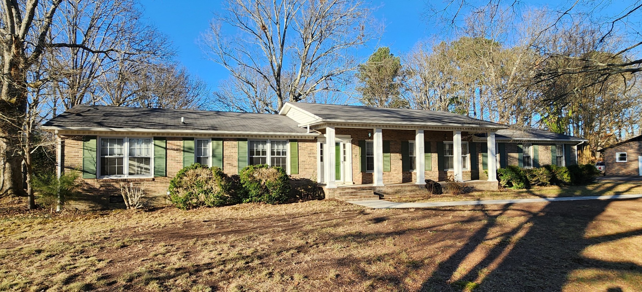 a front view of house with yard porch and seating space