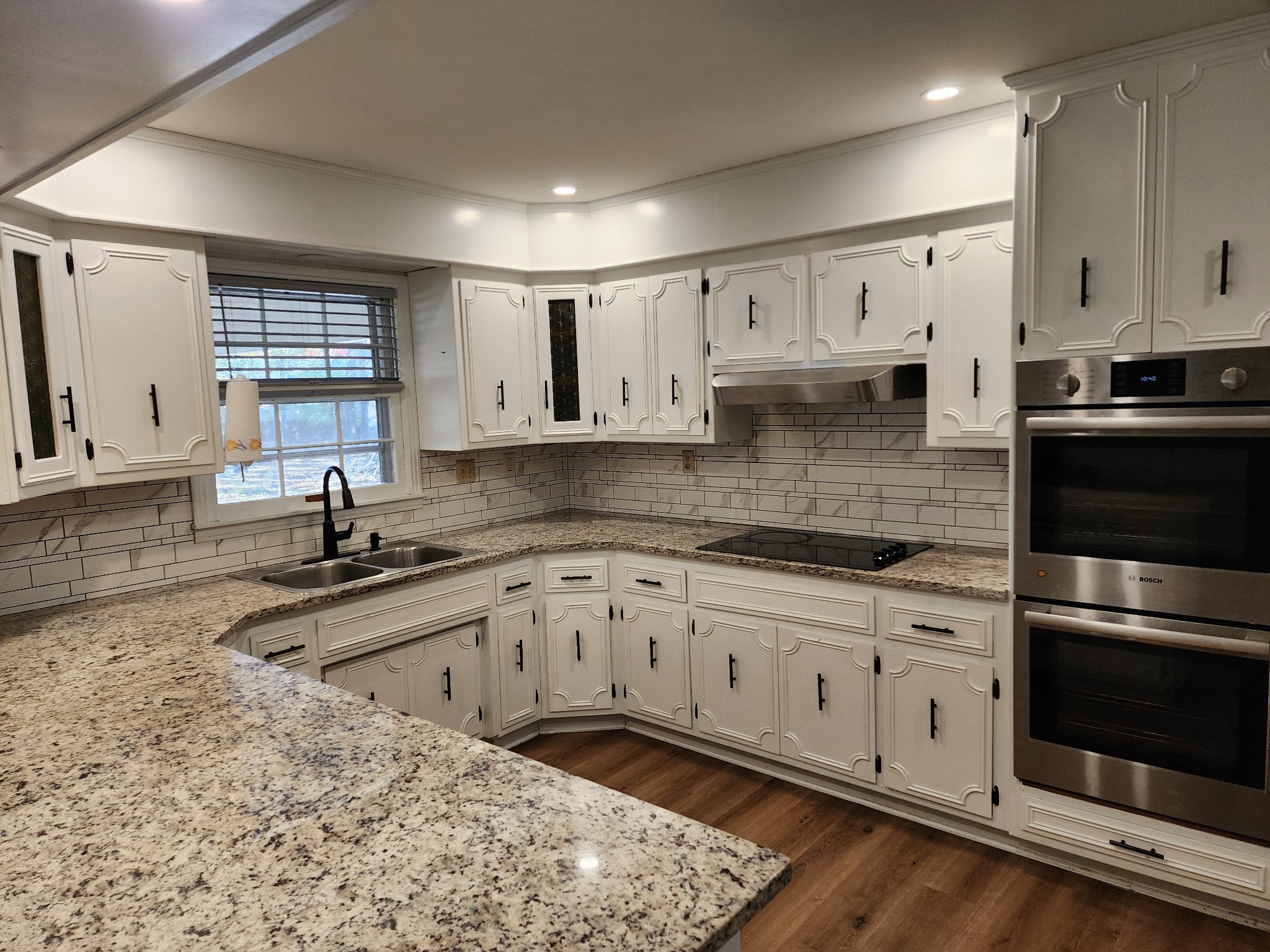 303 12 Oaks Road Tullahoma, TN 37388 - Photo 14 of 39 a kitchen with stainless steel appliances granite countertop a sink and cabinets