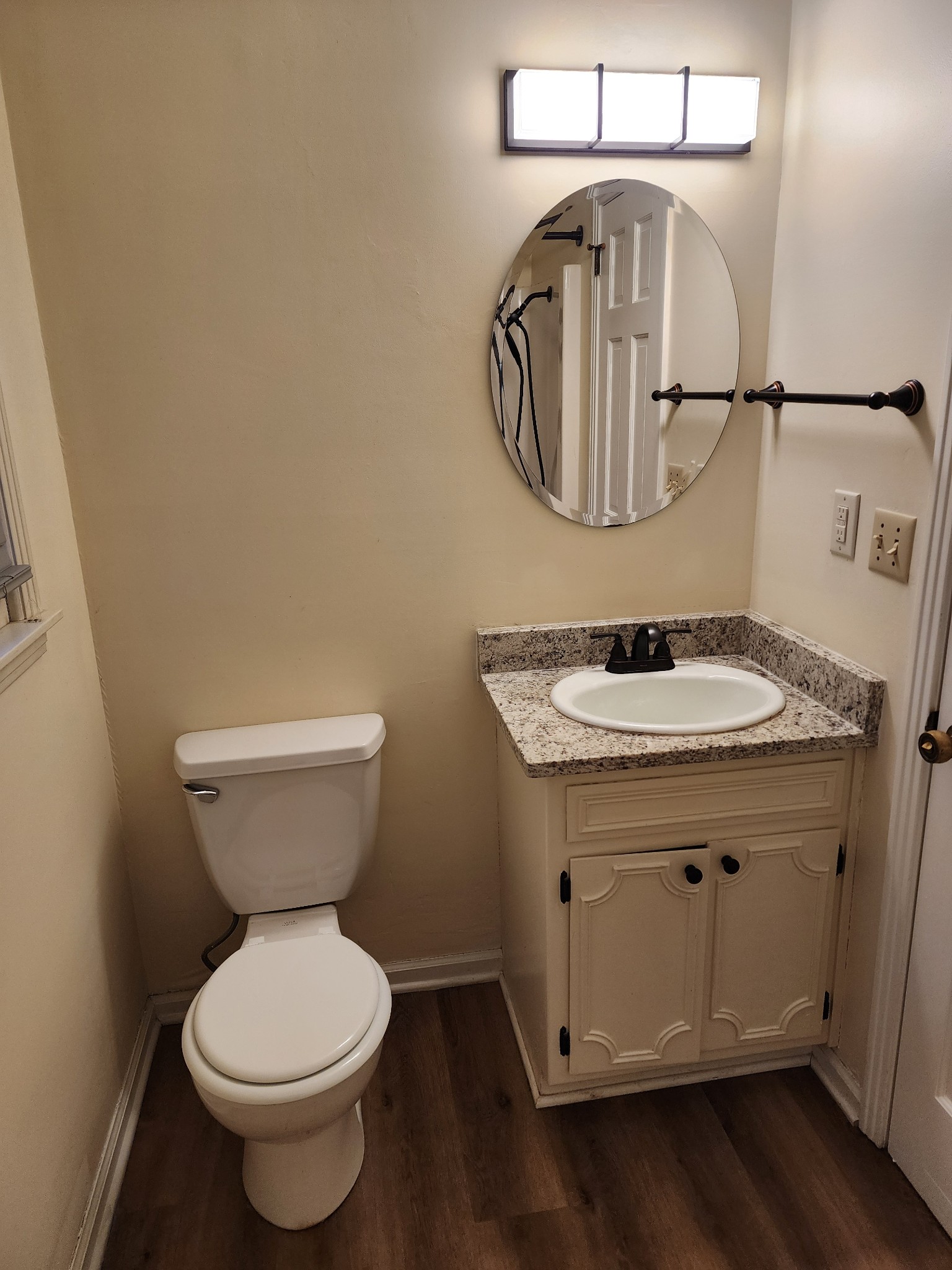 303 12 Oaks Road Tullahoma, TN 37388 - Photo 25 of 39 a bathroom with a toilet a sink and mirror