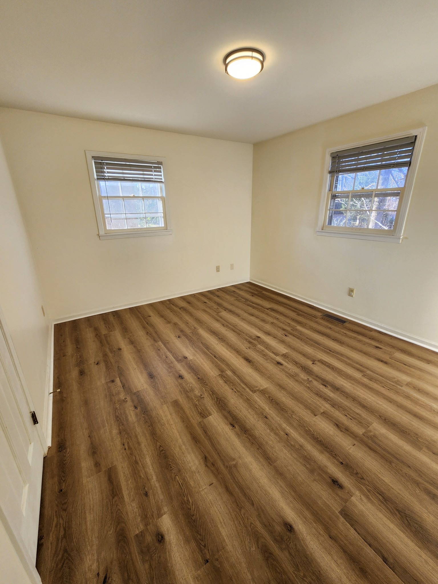 303 12 Oaks Road Tullahoma, TN 37388 - Photo 30 of 39 a view of an empty room with wooden floor