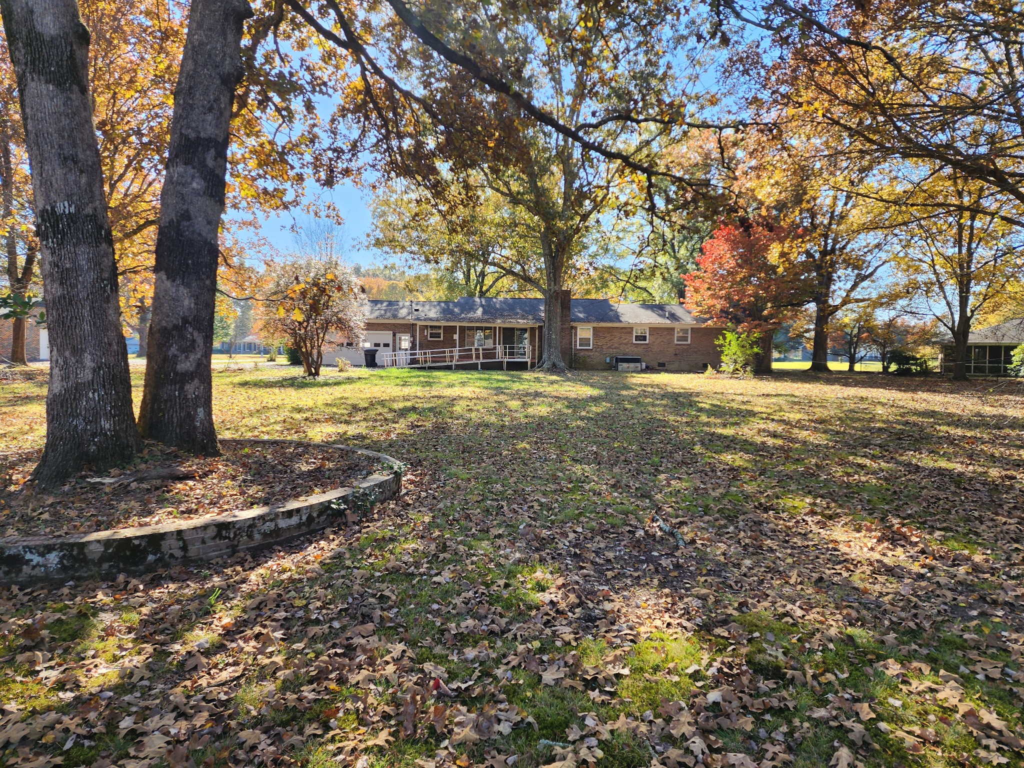 303 12 Oaks Road Tullahoma, TN 37388 - Photo 37 of 39 a view of a yard with plants and trees