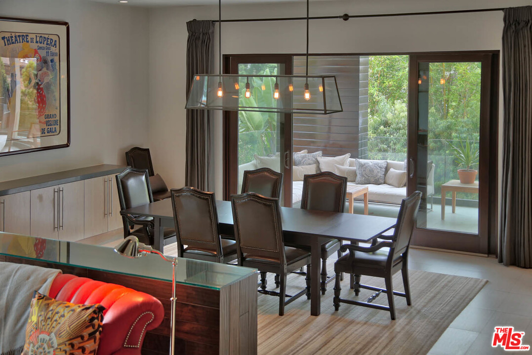 8532 Ridpath Drive Los Angeles, CA 90046 - Photo 12 of 52 a view of a dining room with furniture window and outside view