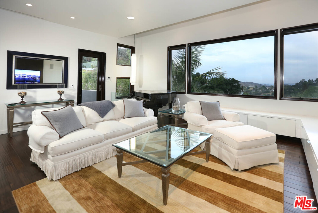 8532 Ridpath Drive Los Angeles, CA 90046 - Photo 13 of 52 a living room with furniture and a large window